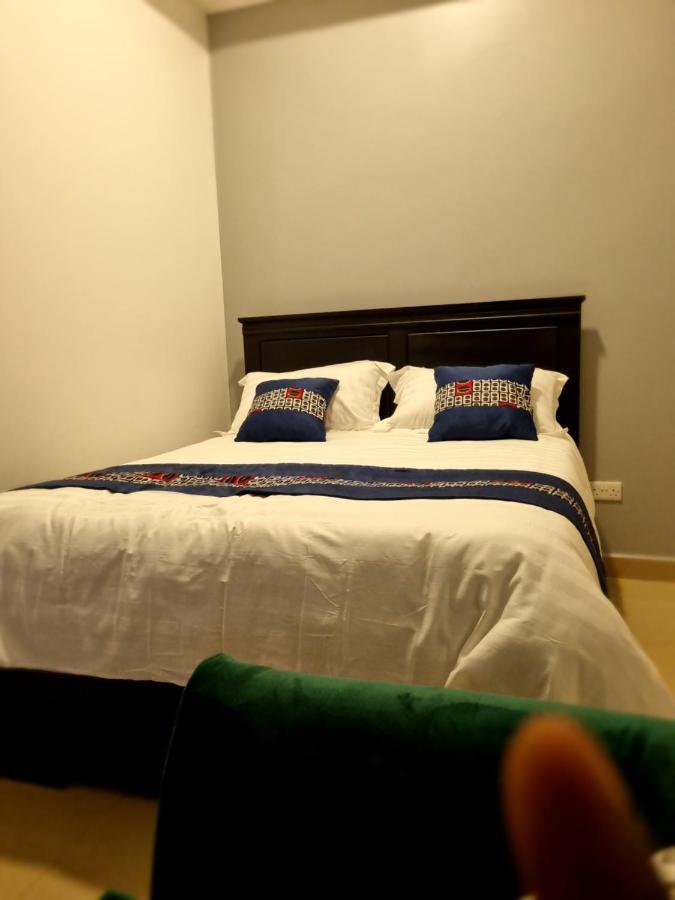 Eika Suites At Acacia Кампала Экстерьер фото